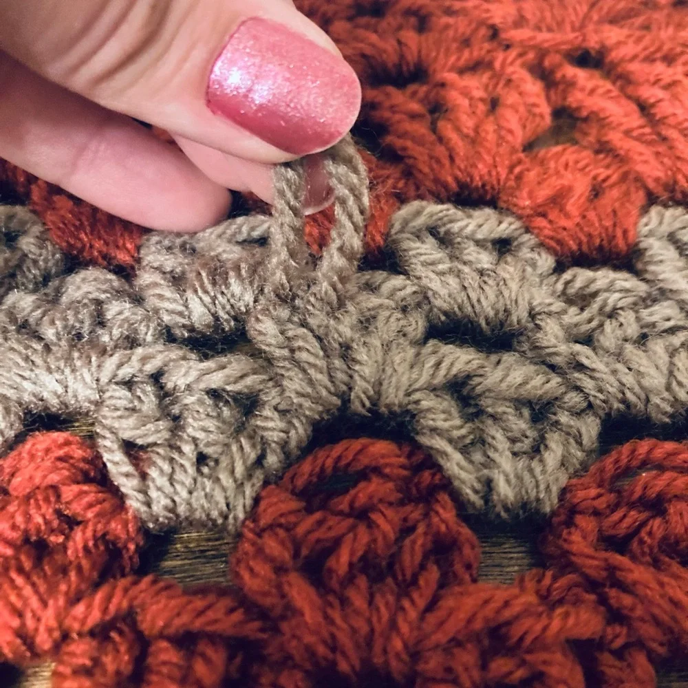 Vintage hand made retro burnt orange and grey knitted crochet granny table cover
